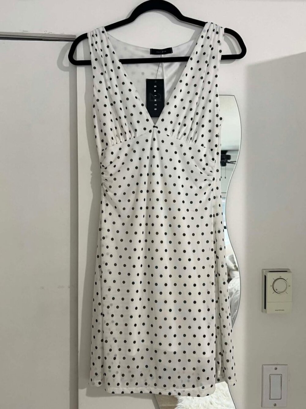 Black and white polka dot sleeveless v-neck dress, medium